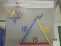 Two equilateral triangles: one of side 9, and one of side 15.  The smaller triangle will not stud down, but the larger one will.