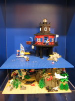 A lighthouse scene inspired by the Seven Foot Knoll lighthouse on display on Pier 5 in Baltimore Harbor. 