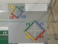 Squares aligned on a slant: one by Pythagorean right triangles, the other by approximation of right isosceles triangles.